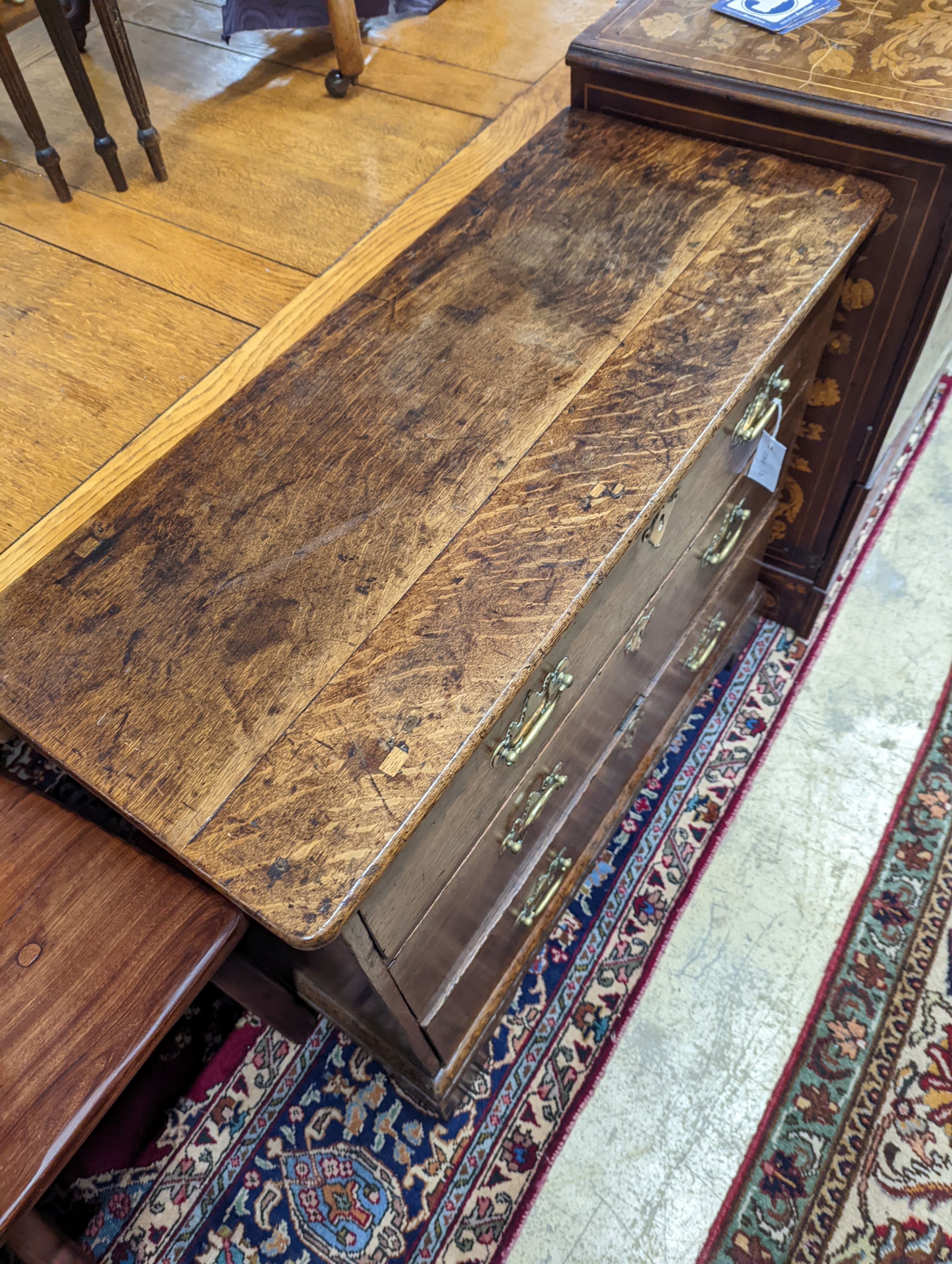 An 18th century oak three drawer chest, width 92cm, depth 39cm, height 80cm